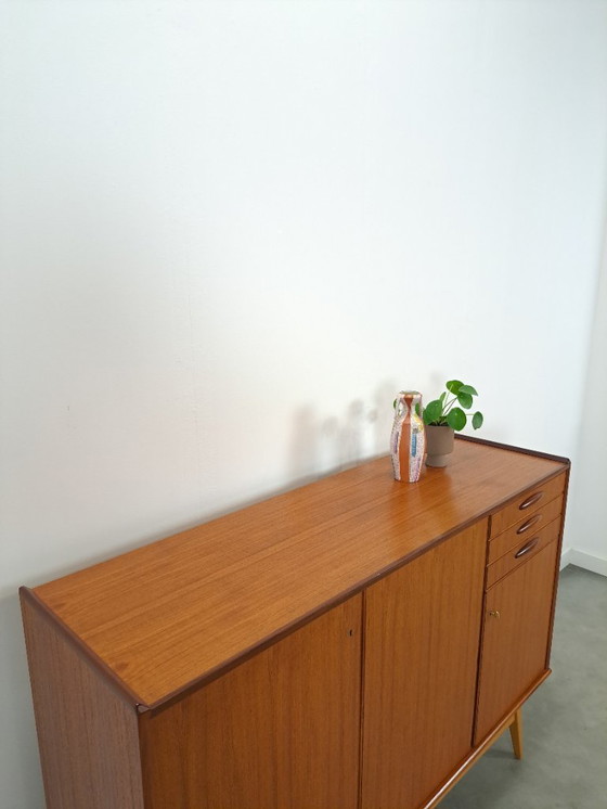 Image 1 of Armadio in teak con gambe inclinate e cassetti dalla Svezia