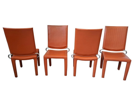 Image 1 of Set van 4 designstoelen in oranje leer en vintage ijzer.