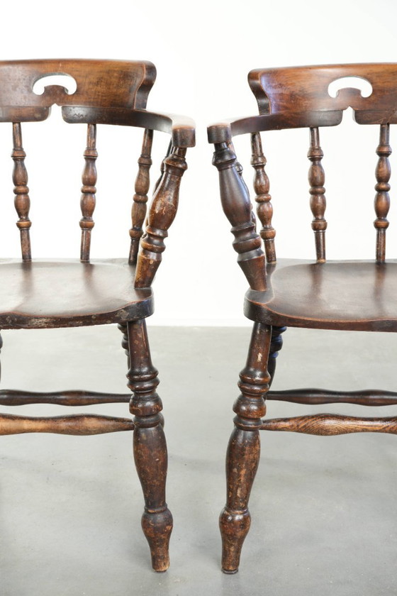 Image 1 of 2x antique English wooden pub/captain chairs from the late 19th century with character and a beautiful color scheme