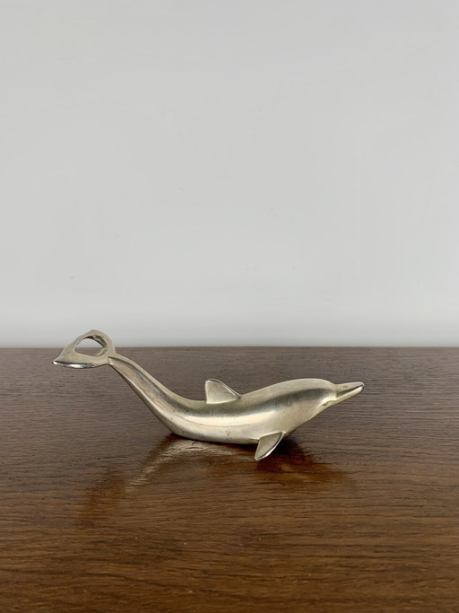 Abridor de botellas Dolphin, 1970-80