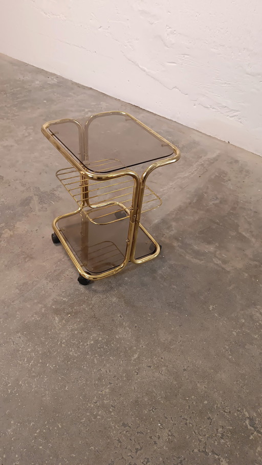 Vintage gold coloured and glass trolley side table