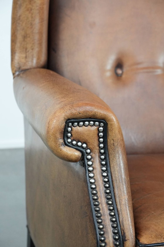 Image 1 of Sheepskin wing chair with a characterful appearance