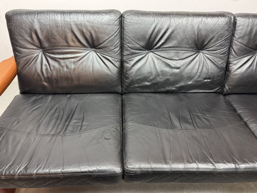 Mid-Century Design Komfort Solid Teak Wooden 3-Seat Sofa with Black Leather Cushions Attributed to Sven Ellekaer by Komfort