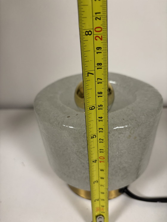 Image 1 of vintage table lamp by Peill & Putzler is made of thick ice glass with brass details