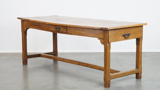 Large antique French farmhouse dining table made of fruitwood from the late 18th century with beautiful and original details.