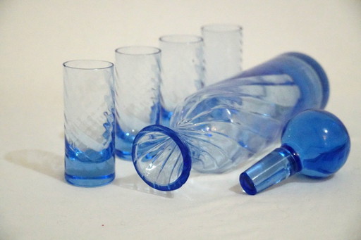 Juego de decantador vintage de vidrio azul con 4 vasos de chupito