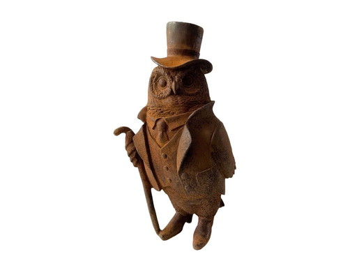 Owl with walking stick and hat made of cast iron