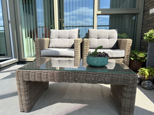 Generous rattan garden set including cushions (2 chairs and table)