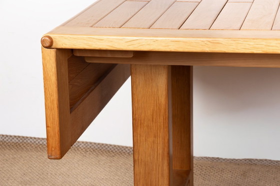 Image 1 of Gran mesa de comedor extensible de roble macizo, diseñada por Guillermo y Chambron en 1960.