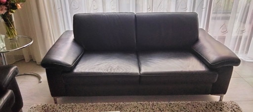 2 Musterring black leather sofas with stainless steel base