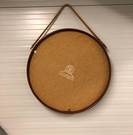 Image 1 of https://www.1stdibs.com/furniture/mirrors/wall-mirrors/pizzetti-cognac-leather-mirror-1950s-italy/id-f_33697732/