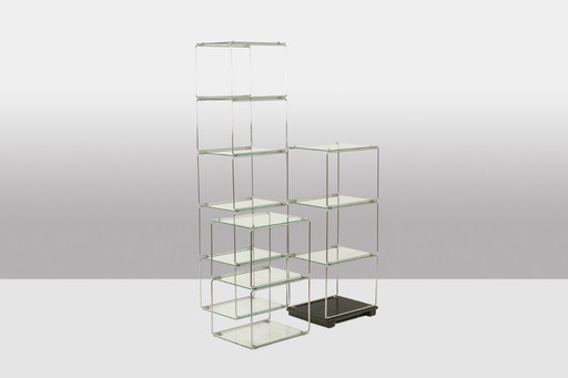 Set of 3 chrome-plated metal and glass shelves. 1970s