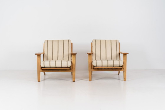 Image 1 of Pair of Early GE-290 lounge chairs in oak by Hans J. Wegner for Getama (Denmark, 1953).