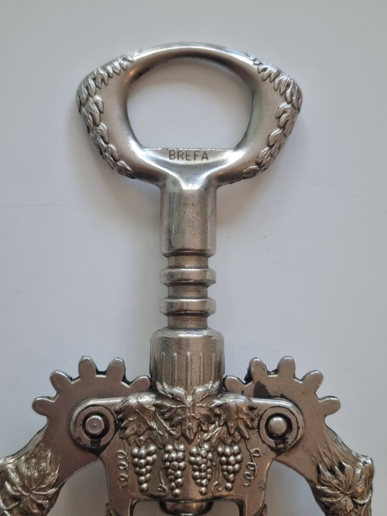 Prachtige vintage kurkentrekker met hendel van BREFA – met design van wijnbladeren en wijnvaten. (photo 2 of 6)