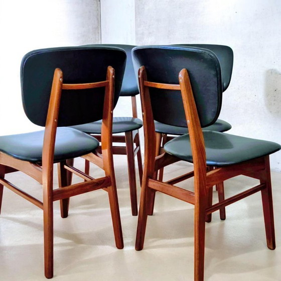 Image 1 of 4 x vintage teakhouten eetkamerstoelen met echt leren (zwarte) bekleding