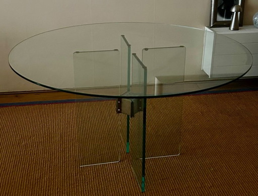 Glass dining table by Peter Ghyzcy.