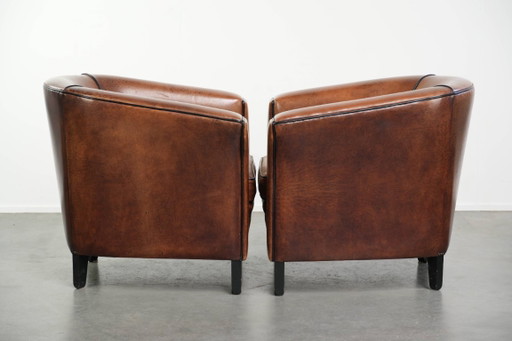2x schapenleren Art Deco design clubfauteuil met een mooi patina, zwarte biezen en mooie kleuren