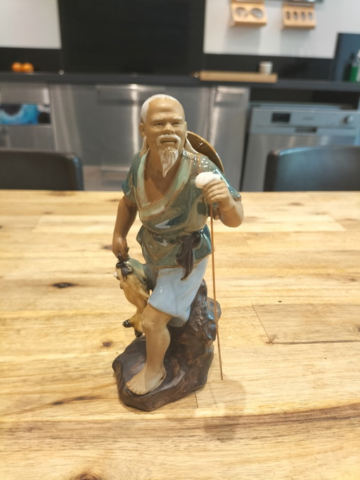 Asian statuette in glazed stoneware