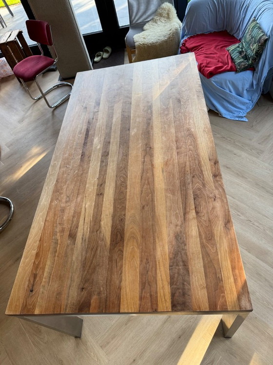 Image 1 of Walnut wood table with stainless steel legs