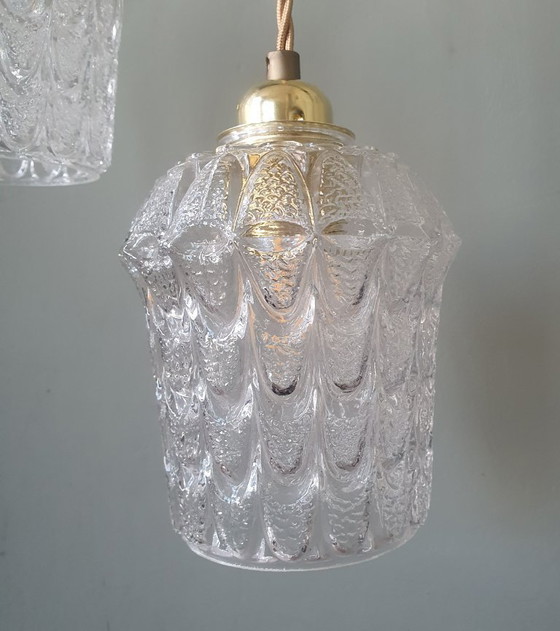 Image 1 of Set of two vintage Mic Century pendant lamps of thick, textured glass.