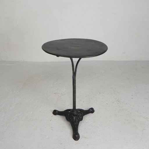 Bistro table with cast iron legs and round steel top, 1930s