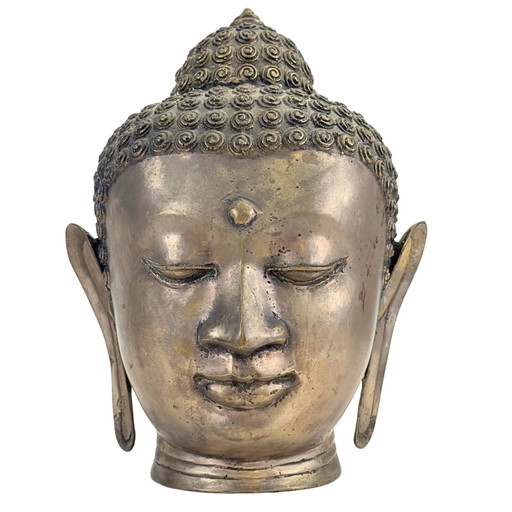 Patinated brass-bronze Buddha head in classic Thai Sukhothai style.