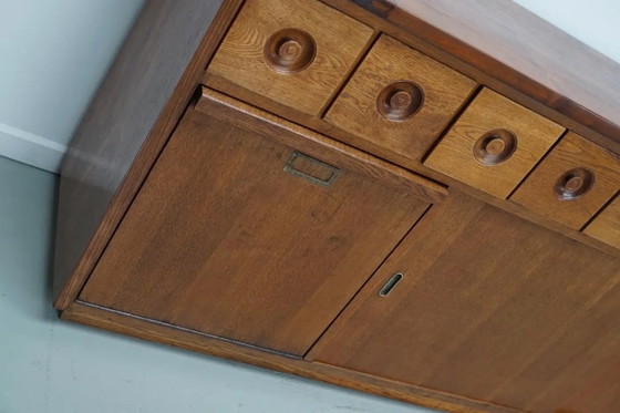 Image 1 of Grote Nederlandse industriële eiken apothekers- / bakkerijkast, ca. jaren 1950