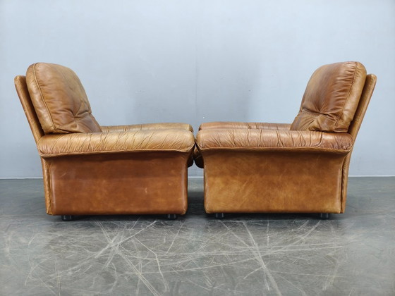 Image 1 of Een paar Arcon Italia loungefauteuils van cognacbruin buffelleer.