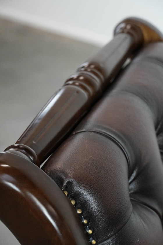 Image 1 of English-style Chesterfield office chair made of cowhide and wood on wheels