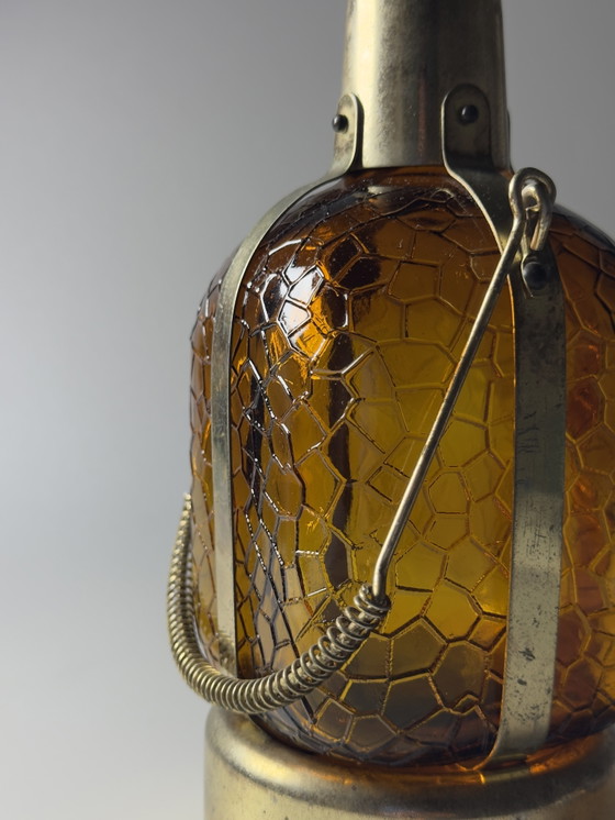 Image 1 of Bouteille carafe musicale vintage – Mécanisme musical à remontoir – Inspiration Steampunk et Art Déco – vers 1970