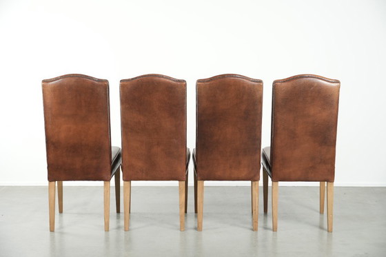 Image 1 of 4 x Vintage eetkamerstoel gemaakt van schapenleer met een hoge rug