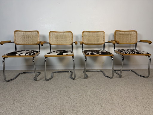 Suite de 4 fauteuils cannés chrome et bois années 70