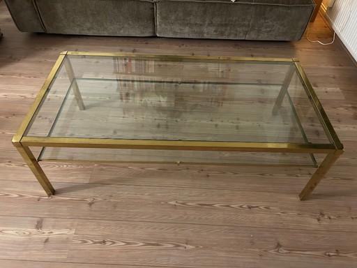Hollywood Regency style coffee table in glass and gold