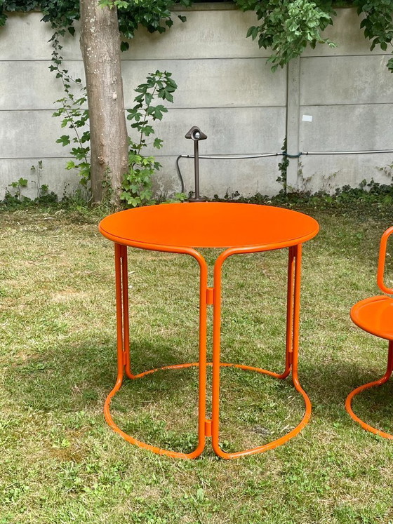 Image 1 of Gae Aulenti - oranje gelakte tuintafel