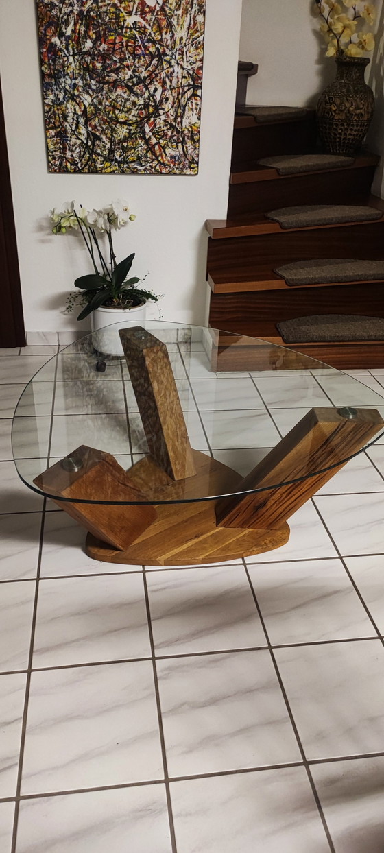 Image 1 of Couchtisch mit Glasplatte & Gestell aus
massiver Wildeiche