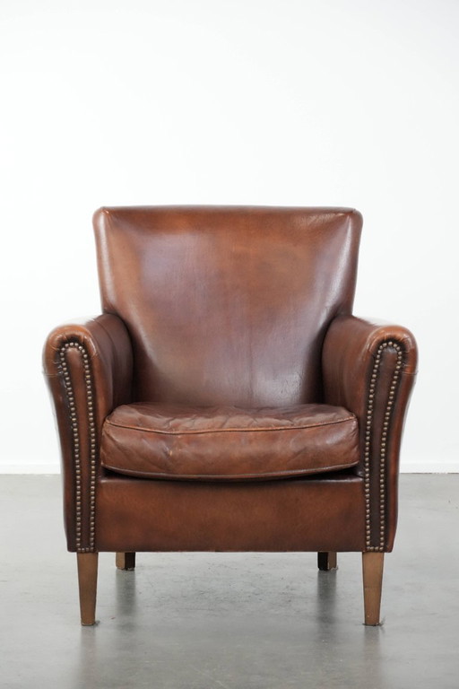 Fauteuil vintage en peau de mouton aux magnifiques couleurs chaudes
