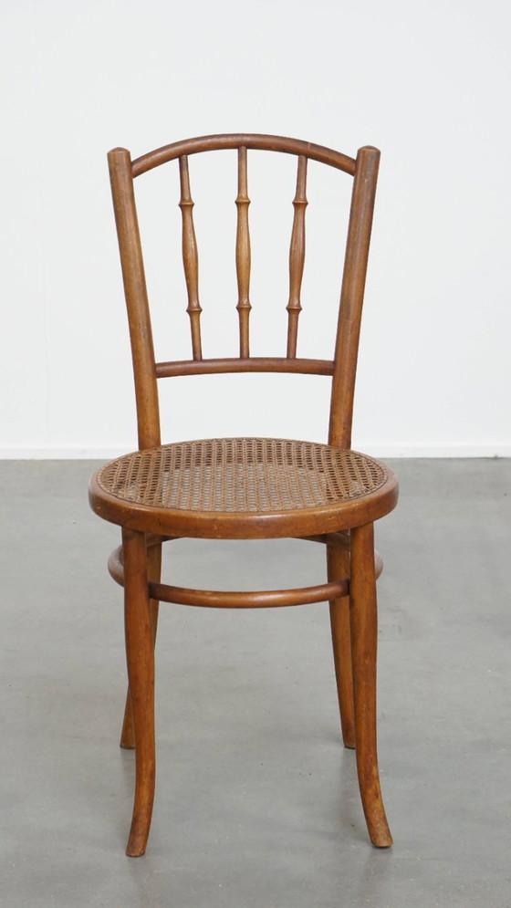 Image 1 of Vintage bistro stoel in de stijl van Thonet met een rieten zitting