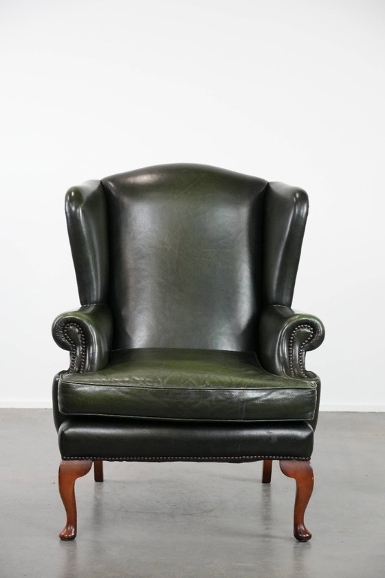 Image 1 of Fauteuil Chesterfield classique en cuir de vachette lisse de couleur vert foncé