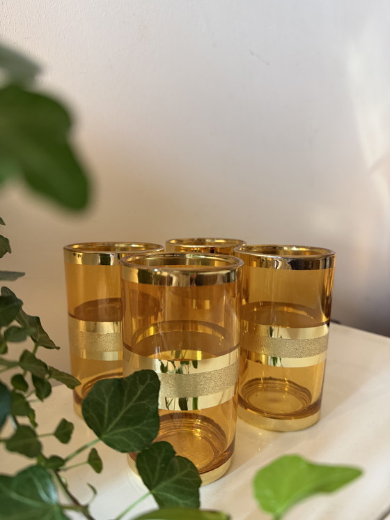 Image 1 of Set van 4 amberkleurige glazen met goudkleurige band