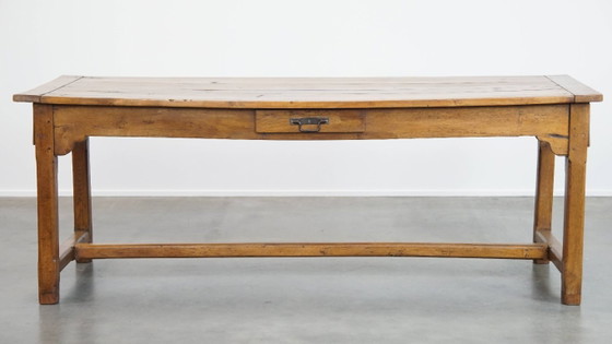 Image 1 of Large antique French farmhouse dining table made of fruitwood from the late 18th century with beautiful and original details.