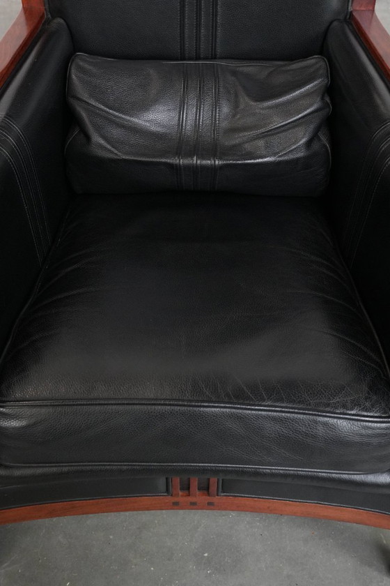 Image 1 of 2 x Black cowhide Art Deco design armchairs with high backs by Schuitema