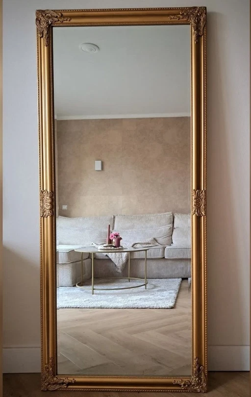 Miroir d'aspect antique en bronze doré avec facettes