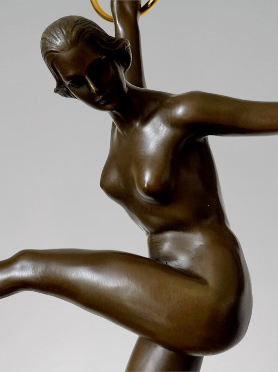 Image 1 of Art Deco sculpture of a dancer with rings in patinated bronze on a black marble-effect base – signed Duvernet – 58 cm