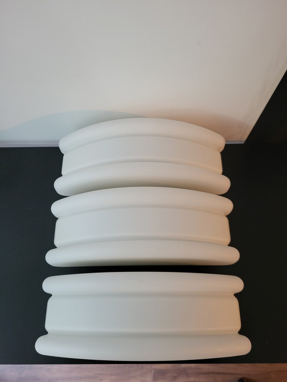 Image 1 of 3 RAAK (bathroom) wall lamps with opaline glass shade and stainless steel frame.