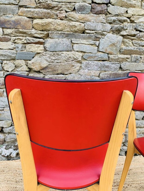 Image 1 of Ein Paar rote Stühle