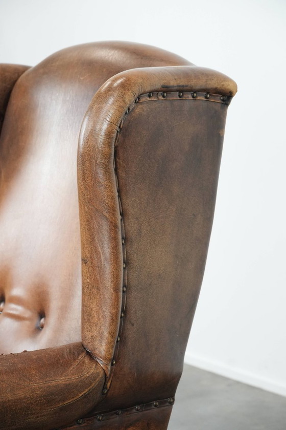 Image 1 of Sheepskin wing chair with a characterful appearance