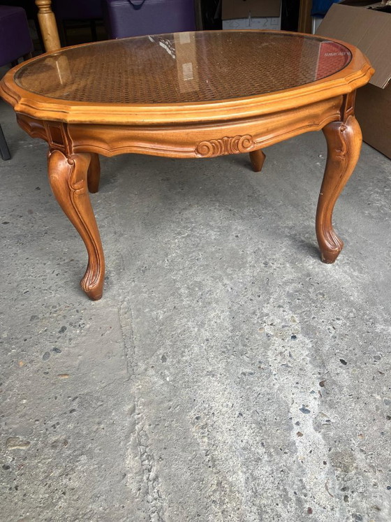 Vintage oval coffee table in French Louis XV style is made of cherry wood and features a glass top over (photo 2 of 8)