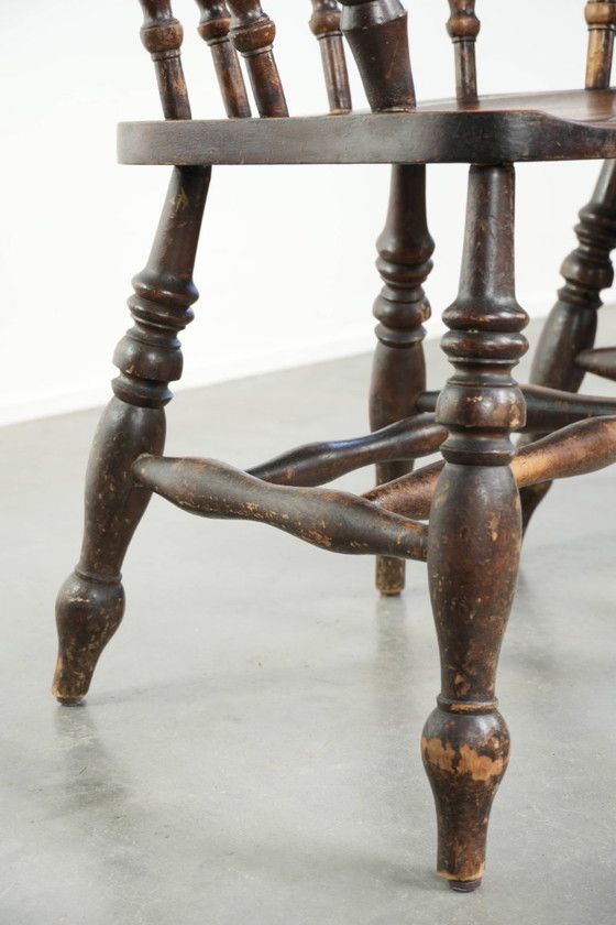Image 1 of 2x antique English wooden pub/captain chairs from the late 19th century with character and a beautiful color scheme