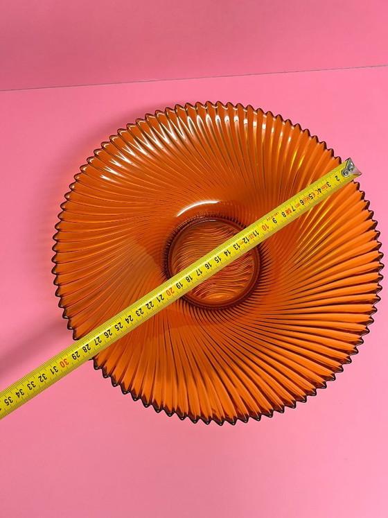 Image 1 of Vintage 70s swirl amber glass amber sunburst fruit bowl sawtooth edge orange