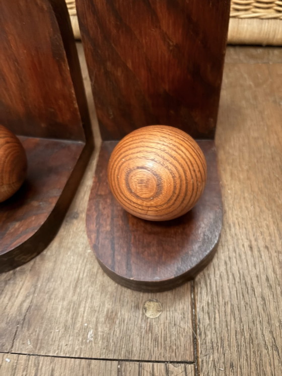 Image 1 of 2x Art Deco bookends. Left the paper in place and don't know if there is anything underneath.